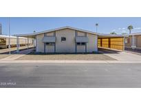 Charming single-story home with carport and well-kept gravel yard at 3330 E Main St # 7, Mesa, AZ 85213