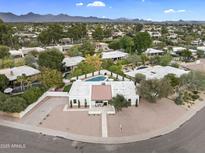 Expansive aerial view of a property featuring a pool, complemented by lush landscaping and scenic mountain views at 8405 N Via Mia --, Scottsdale, AZ 85258