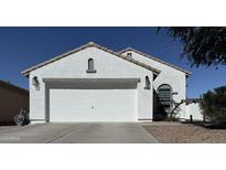 Charming one-story home featuring a two car garage, landscaped front yard, and neutral color palette at 872 W Desert Sky Dr, San Tan Valley, AZ 85143