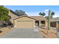 Charming single-story home featuring a two-car garage and low-maintenance desert landscaping at 15853 S 17Th Dr, Phoenix, AZ 85045