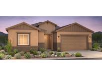 Charming single-story home featuring a neutral color scheme and a two-car garage, great curb appeal at 16698 W Saguaro Park Ln, Surprise, AZ 85387