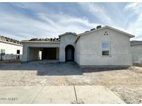 An exterior shot of a one-story home with an attached garage, showing the facade of the building at 22693 E Saddle Way, Queen Creek, AZ 85142