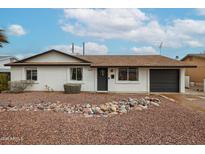 Charming single-story home with a well-maintained front yard and a tidy rock garden feature at 3520 E Ludlow Dr, Phoenix, AZ 85032