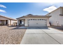 Charming single-story home featuring a two-car garage and low-maintenance desert landscaping at 849 E Impreria St, San Tan Valley, AZ 85140