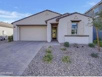 Charming single story home with a two car garage and desert landscaping at 9327 E Static Ave, Mesa, AZ 85212