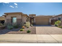 Beautiful single-Gathering home featuring a neutral palette and a well-manicured desert landscape at 32297 N 133Rd Ln, Peoria, AZ 85383