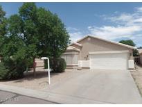 Charming single-story home with a two-car garage and mature landscaping in a well-maintained neighborhood at 39837 N Manetti St, San Tan Valley, AZ 85140
