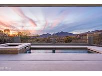 Stunning pool and spa combo overlooks beautiful desert landscape and breathtaking mountain views at 40198 N 105Th Pl, Scottsdale, AZ 85262