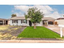 Charming single-story home featuring a low maintenance front yard and a convenient carport at 5016 N 68Th Dr, Glendale, AZ 85303