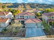 Charming two-story home featuring a three-car garage and beautiful mountain views in a suburban setting at 1333 E Pedro Rd, Phoenix, AZ 85042