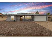 Charming single-story home with gray brick, low maintenance yard and two car garage at 14013 N Boswell Blvd, Sun City, AZ 85351