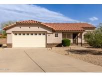 Charming single-story home with a two-car garage, terra cotta tile roof and low-maintenance desert landscaping at 15334 W Via Montoya --, Sun City West, AZ 85375