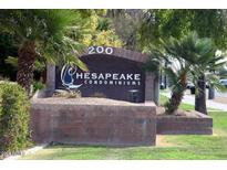 Hesapeake Condominiums community sign on a brick base surrounded by green lawn and trees at 200 E Southern Ave # 316, Tempe, AZ 85282