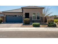 Charming single-story home with a blue garage door, neutral color scheme, and well-maintained landscaping at 2849 W Apollo Rd, Phoenix, AZ 85041