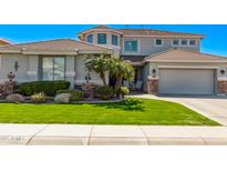 Charming two-story home with a well-manicured lawn and desert landscaping with lovely curb appeal at 3851 E Vallejo Dr, Gilbert, AZ 85298