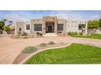 Inviting single-story home featuring desert landscaping and a circular driveway at 4438 E Millbrae Ln, Gilbert, AZ 85234