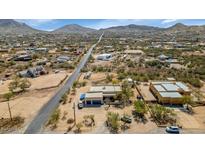 Stunning aerial view of desert home, nestled in a community with mountain backdrop at 1345 E Gaffney Rd, New River, AZ 85087