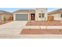 Charming single-story home with a modern design, desert landscaping, and a spacious two-car garage at 17253 W Via Dona Rd, Surprise, AZ 85387