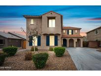 Charming two-story home featuring a tile roof, stucco facade, drought-tolerant landscaping, and a private driveway at 2196 E Brigadier Dr, Gilbert, AZ 85298