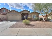 Charming single-story home with desert landscaping, a two-car garage and sunny skies at 46175 W Morning View Ln, Maricopa, AZ 85139