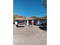 Modest single-story home with desert landscaping and an inviting covered entrance at 510 N Bass Rd, Wickenburg, AZ 85390