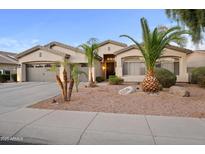 Charming single-story home with a three-car garage and desert landscaping at 686 E Vermont Dr, Gilbert, AZ 85295