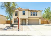Charming two-story home with a well-manicured lawn and inviting curb appeal at 8163 E Posada Ave, Mesa, AZ 85212