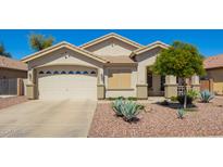 Charming single-story home featuring a two-car garage and xeriscaped front yard at 12508 W Highland Ave, Litchfield Park, AZ 85340