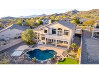 Gorgeous backyard with pool, putting green and mountain views at 8219 E Tesoro Cir, Mesa, AZ 85207