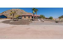 Charming single-story home with desert landscaping and steps leading to the front entrance at 1440 W Christie Lyn Ln, San Tan Valley, AZ 85144