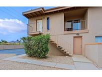 Apartment exterior with stairs leading to second floor entry, plus front-facing balcony at 14620 N Yerba Buena Way # D, Fountain Hills, AZ 85268