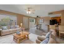 Inviting living room features neutral walls, and wood accents leading to the dining area, perfect for relaxing or entertaining at 17056 E Calle Del Oro Dr # B, Fountain Hills, AZ 85268