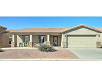 Charming single-story home featuring a covered porch, low-maintenance landscaping, and attached two car garage at 2101 S Meridian Rd # 190, Apache Junction, AZ 85120