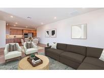 Inviting living room with a comfortable sofa, stylish chairs, and an open concept to the kitchen at 2121 W Sonoran Desert Dr # 93, Phoenix, AZ 85085