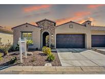 Charming single-story home featuring a well-manicured front yard and an inviting entrance at 3931 N 163Rd Dr, Goodyear, AZ 85395