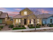 Charming, two-story home featuring stone accents, covered porch, and manicured landscaping at 4457 E Bernice St, Gilbert, AZ 85295