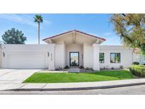 Charming one-story home with a well-manicured lawn and attached two-car garage at 8336 N 72Nd Pl, Scottsdale, AZ 85258