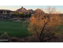 Scenic golf course view featuring lush green fairway and mountain views at sunrise at 10222 E Southwind Ln # 1054, Scottsdale, AZ 85262