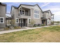 Attractive exterior of a two-story townhome with balcony and modern architectural details at 11300 N Casa Dega Dr # 1020, Surprise, AZ 85388