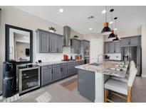 Well-appointed kitchen with gray cabinetry, stainless steel appliances, and granite countertops at 12047 E Sereno Rd, Gold Canyon, AZ 85118