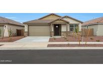 Charming single-story home featuring a neutral palette, two-car garage, and low-maintenance desert landscaping at 17310 W Via Dona Rd, Surprise, AZ 85387