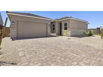 Charming home showcasing a lovely paver driveway leading to an attached two-car garage at 4211 E Desert Vista Trl, Cave Creek, AZ 85331