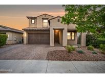 Charming two-story home with a well-manicured front yard and a two-car garage at 10024 E Tamery Ave, Mesa, AZ 85212