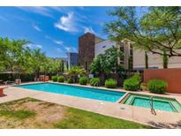 Relaxing community pool and hot tub with lush landscaping for an outdoor retreat at 1005 E 8Th St # 3017, Tempe, AZ 85281