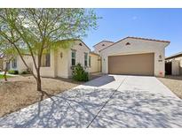 Beautiful single-story home with a two car garage and low maintenance desert landscaping at 1800 N 156Th Dr, Goodyear, AZ 85395