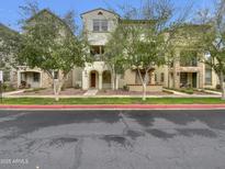 Inviting townhouse with well-kept landscaping and charming architectural details at 2746 S Harmony Ave, Gilbert, AZ 85295