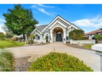 Impressive home with meticulously maintained landscaping and a circular driveway at 3120 E Waterman Ct, Gilbert, AZ 85297