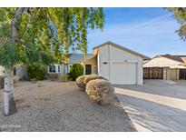 Charming single-story home featuring a well-maintained front yard and attached garage at 3129 W Mohawk Ln, Phoenix, AZ 85027