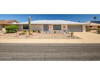 Charming single-story home with desert landscaping, decorative brickwork, and an attached two-car garage at 13114 W Castlebar Dr, Sun City West, AZ 85375