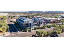 Modern apartment building with well-manicured landscaping and beautiful mountain views in the distance at 16580 N 92Nd St # 2003, Scottsdale, AZ 85260